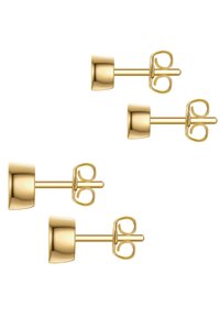 Los pendientes de Stud en tono dorado presentan un diseño de barril redondeado con un cierre decorativo en forma de lazo. Textura suave con un acabado pulido, proporcionando un aspecto elegante.