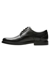 Schwarze Lederdressschuhe mit einer glatten, glänzenden Oberfläche. Sie verfügen über eine abgerundete Zehenpartie, sechs Ösen für die Schnürsenkel und eine niedrige, strukturierte Gummisohle.