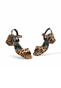 Sandalias de tacón con estampado de leopardo, con punta abierta, tira en el tobillo y tacón cuadrado. Fabricadas con un material suave y con una superficie texturizada.