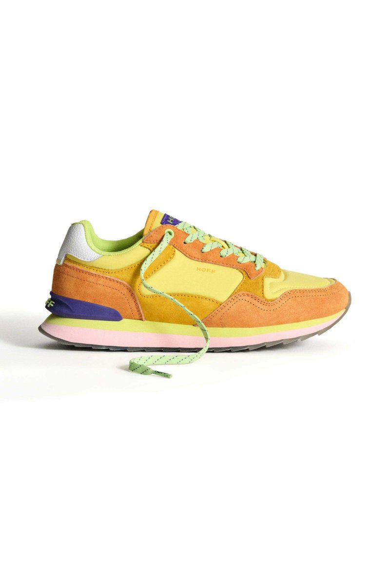 Multicolored sneaker with suede and mesh materials in orange, yellow, and green. Features round laces, purple heel accent, and pink sole.