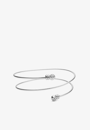 Podesiva srebrna narukvica s dva završna dijela ukrašena malim prozirnim kristalima. Glatki, minimalistički dizajn s okruglim oblikom.