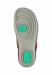 Red shoe sole with a smooth gray base. Circular green cushioning detail in the middle and layered tread patterns. Size marked as 38.