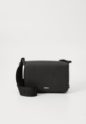Black crossbody bag made of textured material, featuring a logo on the front, adjustable strap, and rectangular shape.