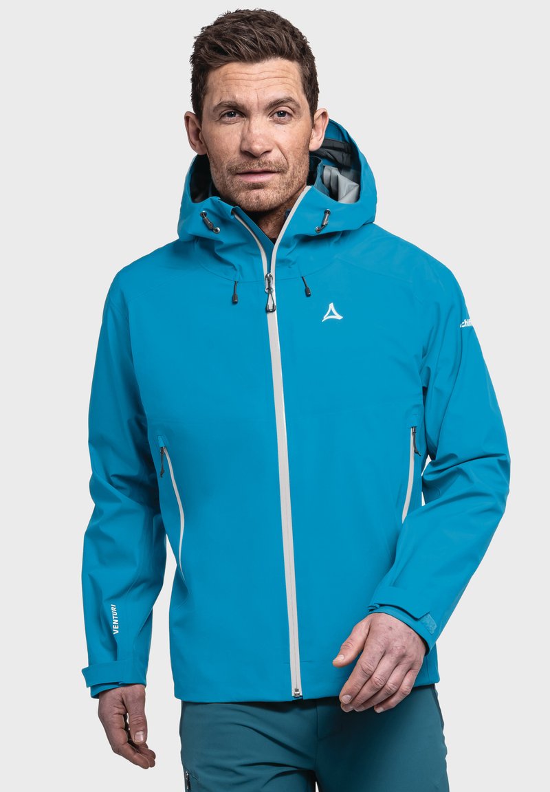 Blaue wasserdichte Jacke mit Kapuze, weißem Reißverschluss und verstellbaren Bündchen. Verfügt über zwei Seitentaschen und ein Logo auf der Brust und dem Ärmeln.