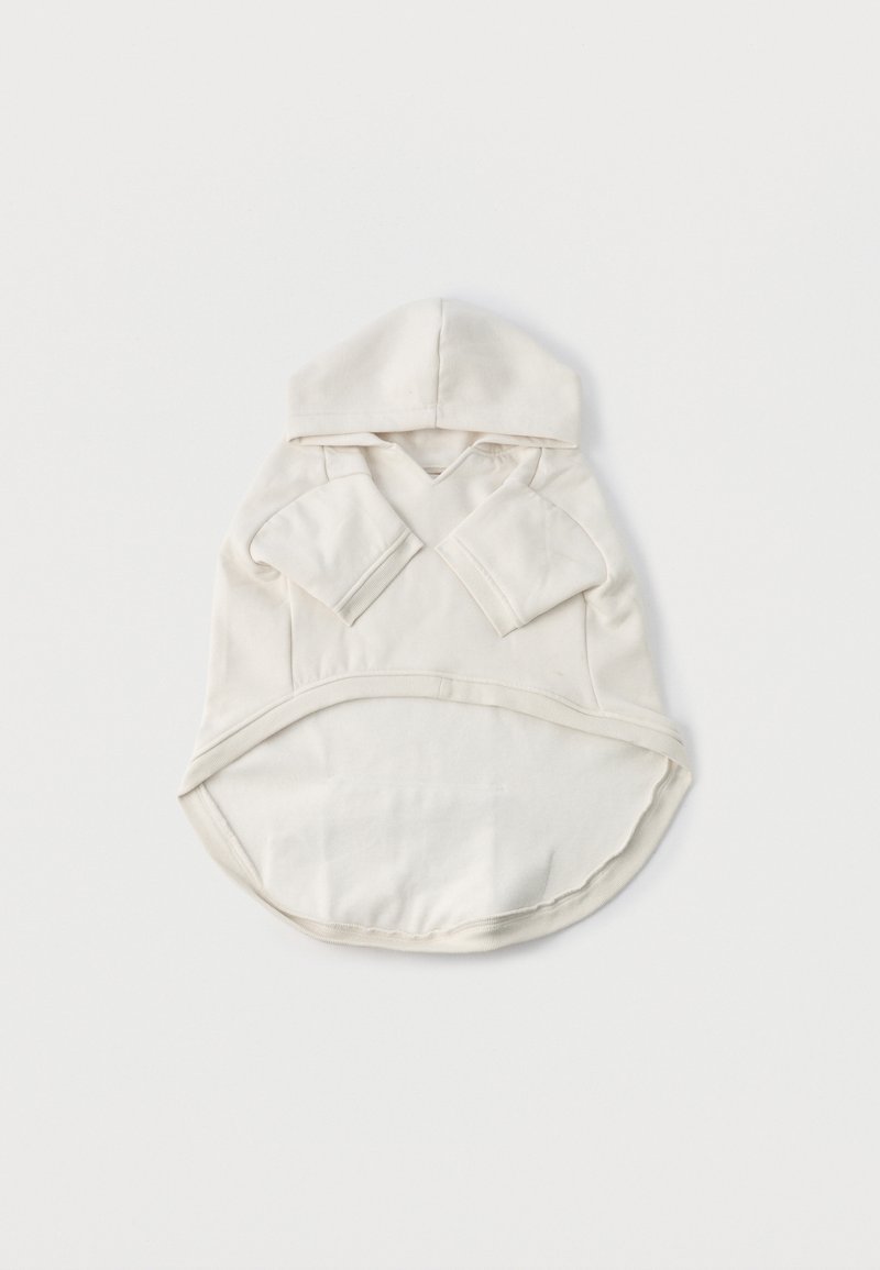 Kapuutsiga dressipluus kreemjas puuvillas, millel on pikad varrukad, ümar äär ja lõikega kaelus. Pehme tekstuur ja minimalistlik disain.