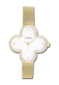 Montre avec bracelet en maille dorée et un cadran blanc en forme de trèfle à quatre feuilles. Équipée d'index et d'aiguilles dorés, avec la marque « OOZOO » affichée.