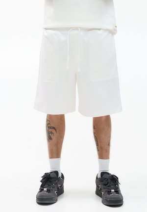 INTERLOCK JOGGER - BERMUDA - Tracksuit bottoms - white