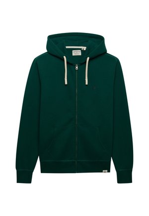 Sudadera con capucha y cremallera en verde oscuro, con cordones crema, bolsillos delanteros y pequeño logo bordado en el pecho.