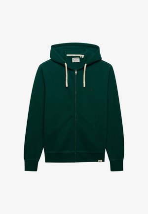 Dunkelgrüner Hoodie mit Reißverschluss, cremefarbenen Kordeln, Fronttaschen und kleinem gesticktem Logo auf der Brust.