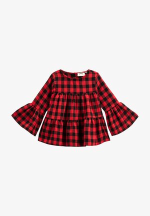 Czerwono-czarna w kratę bluzka z długim rękawem, z rozszerzonymi rękawami i warstwowym fasonem. Materiał jest miękki, z okrągłym dekoltem i zapięciem na guziki.