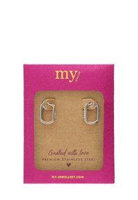 Pendientes de aro de acero inoxidable premium exhibidos en una tarjeta marrón texturizada dentro de un paquete rosa vibrante con texto amarillo.