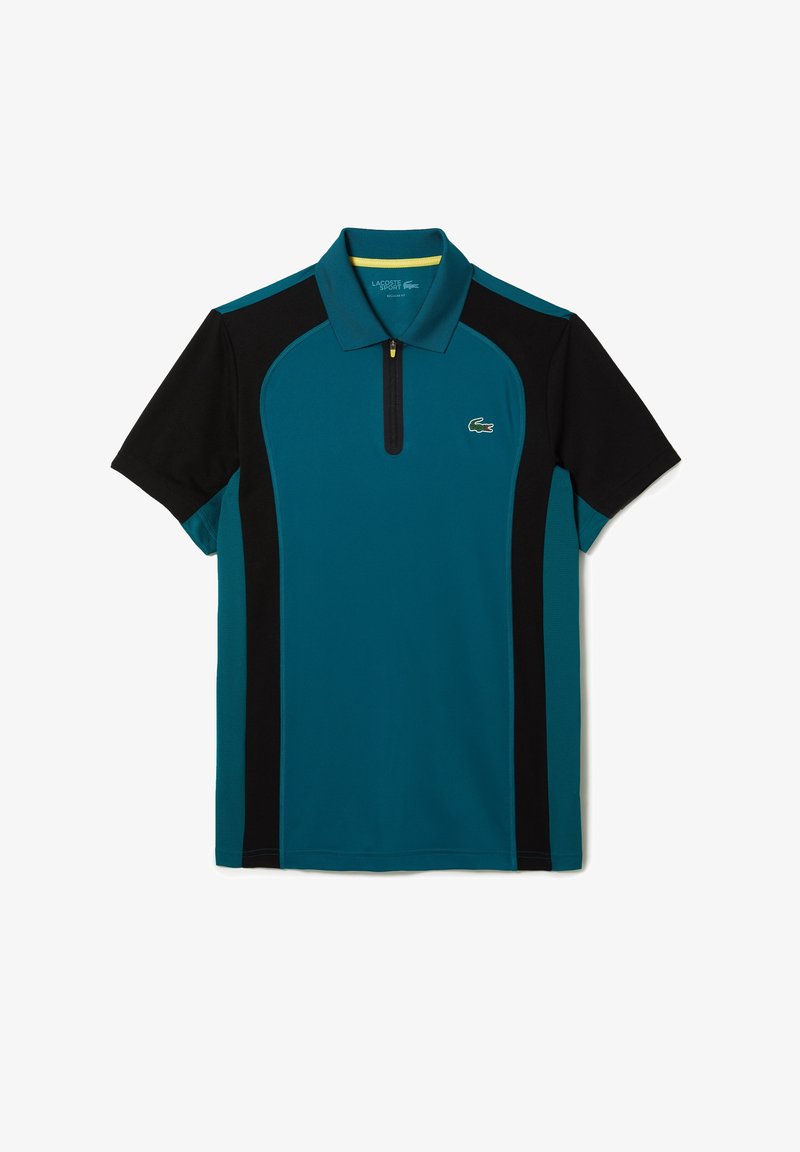 Polo manches courtes bleu sarcelle et noir avec col zippé et petit logo crocodile vert sur la poitrine.