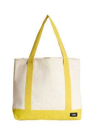 Canvas-tote taske med lyse gule håndtag og bund, off-white krop og et lille Vans-logo i nederste højre hjørne.