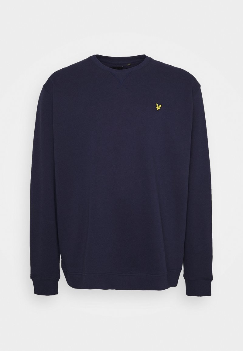 Sweat-shirt bleu marine à manches longues avec col rond, petit logo d’oiseau jaune sur la poitrine gauche, poignets et bas côtelés.