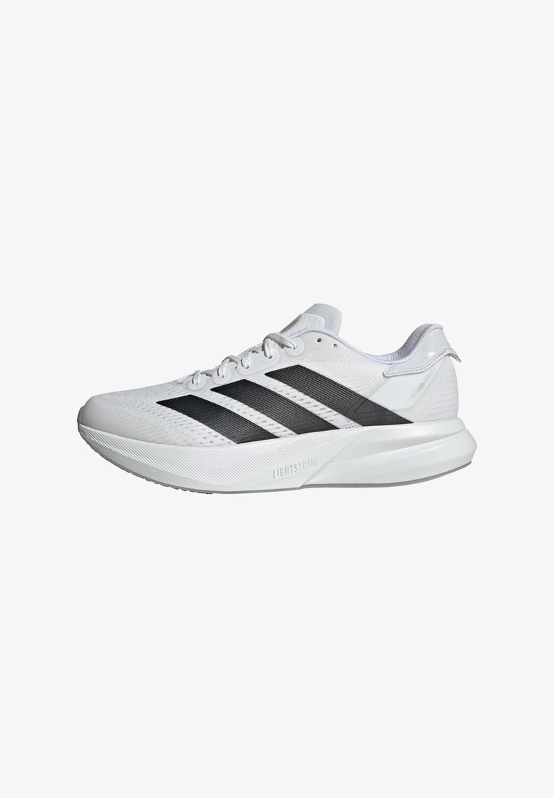 White athletic shoes with a breathable mesh upper, featuring three black stripes, a lightweight design, and textured sole for grip.