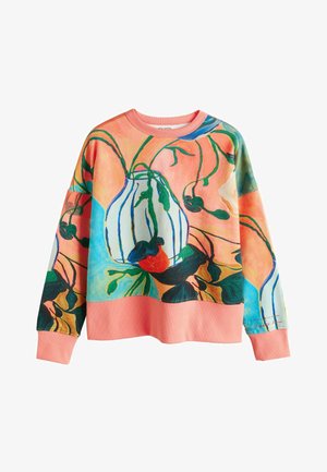 Mitmevärviline dressipluus lillese mustriga rohelises, punases ja sinises toonis, mis asub virsikuvärvilisel taustal. Pehme materjal ja lõdvestunud lõige.