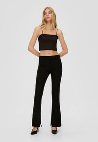 QS MIT BIESEN - Broek - schwarz
