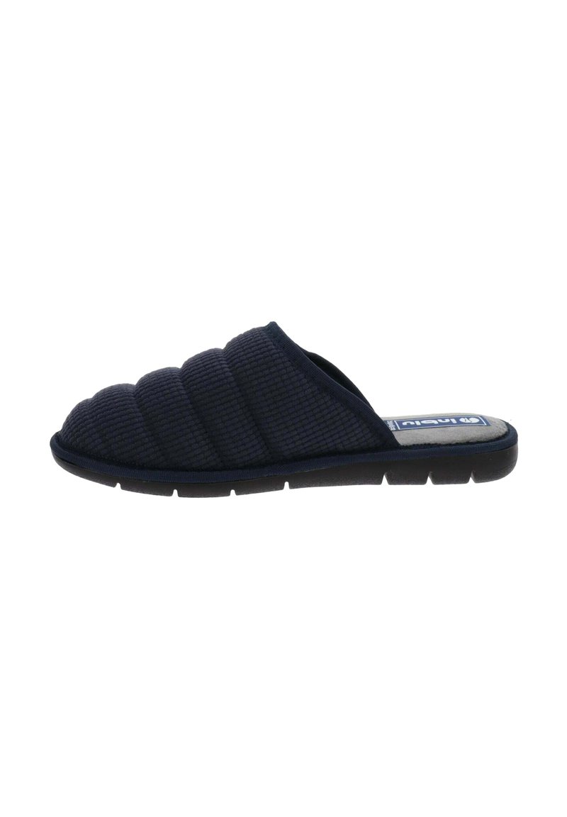 Pantofole slip-on trapuntate blu scuro con suola imbottita, apertura sul retro e tessuto morbido.
