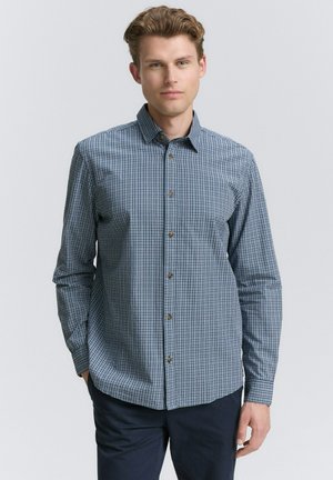 Langsleeve geruite shirt in navy en wit, met knopen aan de voorkant en een klassieke kraag. Katoenen stof, relaxte pasvorm.