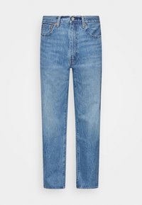 Light blue denim jeans with a straight cut, five pockets, button closure, and subtle fading throughout fabric.