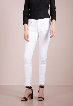 Vaqueros pitillo - white denim