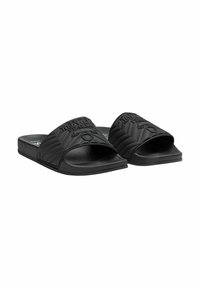 Black slide sandals made of textured rubber, featuring a wide strap with embossed logo and a flat sole. Simple design with no additional accents.