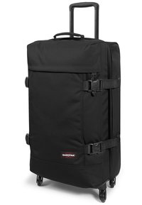 Maleta blanda negra con ruedas, asa extensible y correas ajustables. Presenta el logo de Eastpak en el frente.