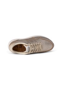 Beige athletic sneaker with a textured upper, perforated detailing, and a cork insole. Features round laces and a contrasting rubber outsole.