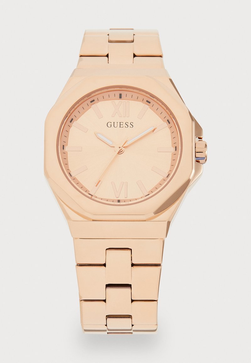 Rose gold watch with octagonal case, minimalist dial, Roman numeral markers, and a linked metal bracelet. Smooth texture and polished finish.