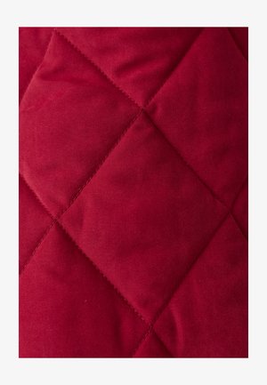 Red quilted fabric featuring a diamond pattern, smooth texture, and evenly spaced stitching, ideal for outerwear or blankets.
