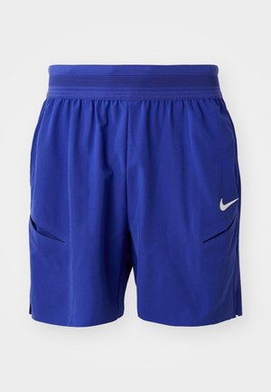 Mėlynos sportinės šortai su elastingu juosmeniu, šoninėmis kišenėmis ir mažuoju baltu Nike swoosh logotipu ant dešinio kojos.