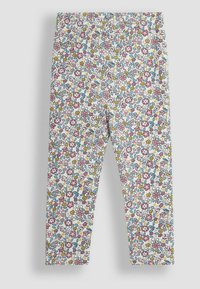 Leggings a vita elasticizzata con motivi floreali multicolore su sfondo bianco, realizzati in tessuto morbido con una superficie liscia.