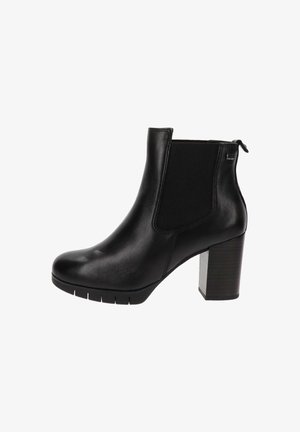 Bottines noires en cuir avec des panneaux latéraux élastiques, bout rond et talons épais au look bois texturé.