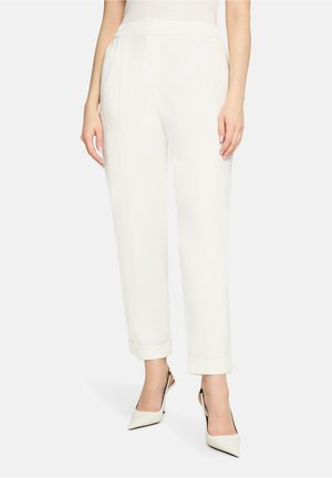 White, tailored trousers with a slightly loose fit, featuring a cuffed hem and elastic waistband, made from a lightweight material.