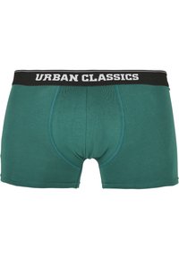 Türkise Boxershorts mit einem schwarzen elastischen Bund, auf dem "URBAN CLASSICS" in weißer Schrift steht. Glattes Material mit modernem Schnitt.