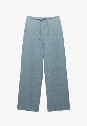 Lichtblauwe wijde broek met een gestructureerd golfpatroon, een trekkoord in de taille en een zachte stof. Ideaal voor een ontspannen look.