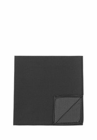 Black table mat featuring a grid pattern of small white dots. Rectangular shape with a textured surface and a contrasting folded corner.