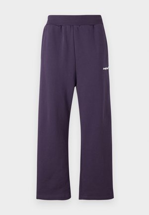Joggers in cotone viola con vita elastica, caratterizzati da un design a gamba dritta e un piccolo logo bianco sul davanti.