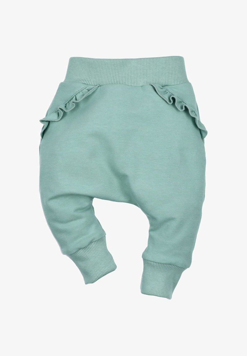 Jasnozielone bawełniane dresy z żebrowanym pasem i ściągaczami, z falbanami na bocznych kieszeniach jako dodatkowy detal.