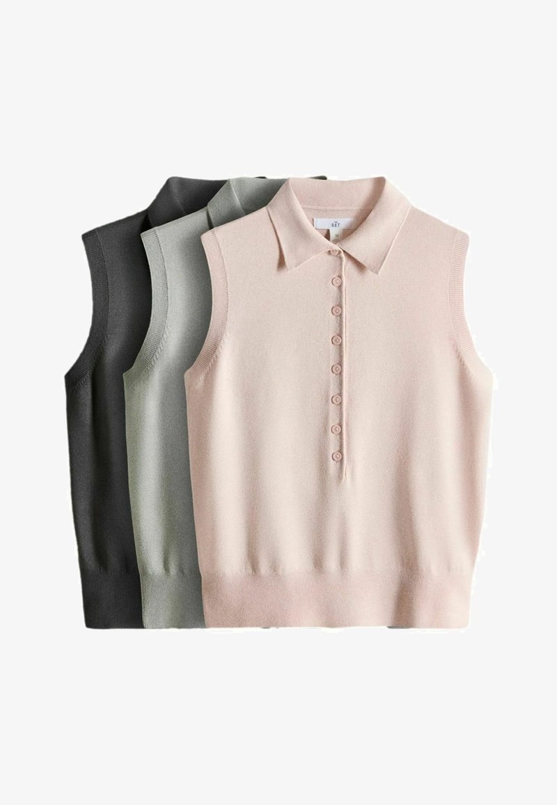 Trois polos sans manches en maille noire, gris clair et rose pâle, chacun avec des patte de boutonnage et des ourlets côtelés, empilés côte à côte.