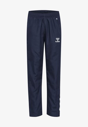 Marineblauwe sportbroeken met een elastische tailleband, voorzien van een wit logo en accenten, gemaakt van lichtgewicht, gladde stof.