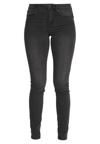 Jeans negros ajustados de mezclilla, con una cintura alta, diseño de cinco bolsillos y sutiles detalles de desvanecimiento, adaptados para un ajuste ceñido.