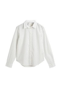 White button-up shirt with long sleeves, featuring a black polka dot pattern, classic collar, and a straight hem. Made from lightweight fabric.