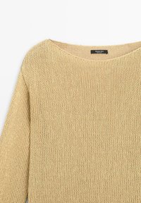 Beige knitted sweater with a round neckline and long sleeves, featuring a visible Massimo Dutti brand label inside the collar.