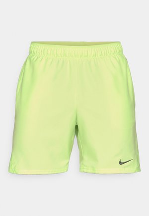 Neonowe żółto-zielone szorty Nike z elastycznym paskiem w talii, gładką fakturą i czarnym akcentem logo Nike w dolnym lewym rogu.