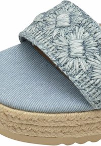 Blue espadrille sandal featuring a woven upper with floral patterns, soft denim-like footbed, and a braided jute midsole detail.
