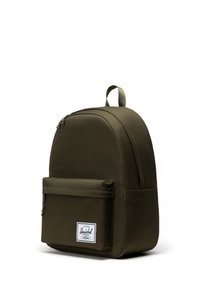Olive green backpack with a rounded shape, made of durable fabric. Features a front zip pocket and a logo patch. Simple design with minimal accents.