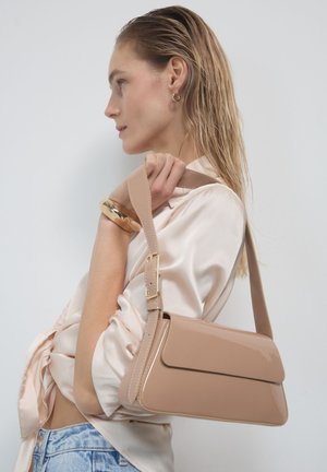 Calliope Handtasche - nudo