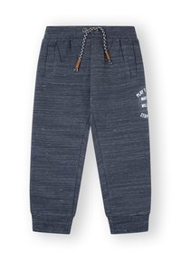 Pantalones de chándal azul marino hechos de tejido texturizado, con cintura elástica y cordón, bolsillos laterales y detalle de texto impreso.