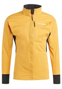 Yellow Terrex jacket with a high collar, black accents, zippered chest pocket, and long sleeves. Made from smooth, weather-resistant fabric.